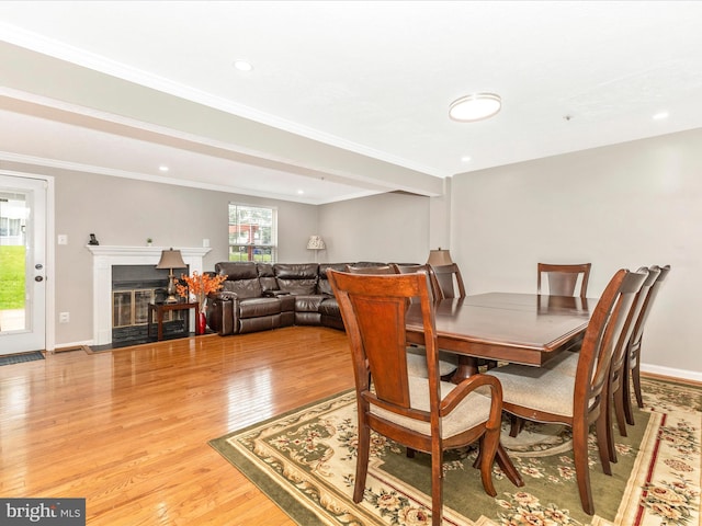 20523 Staffordshire Dr, Germantown, MD 20874 - dining space with light wood-style floors, recessed lighting, crown molding, a fireplace with flush hearth, and baseboards