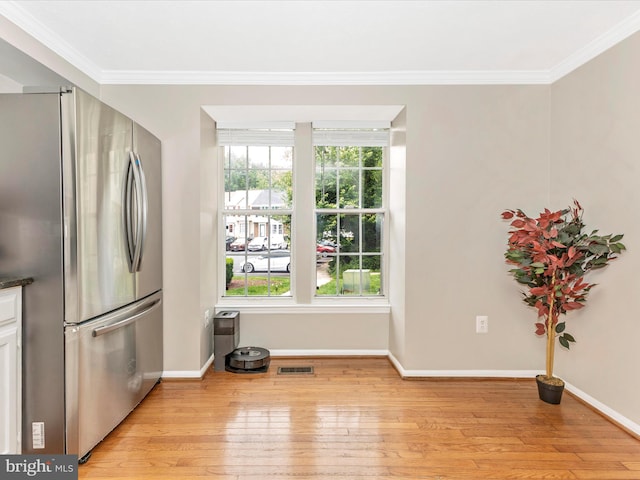 20523 Staffordshire Dr, Germantown, MD 20874 - kitchen featuring freestanding refrigerator, light wood-style floors, crown molding, baseboards, and dark countertops