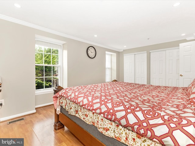 20523 Staffordshire Dr, Germantown, MD 20874 - bedroom featuring two closets, recessed lighting, ornamental molding, baseboards, and wood finished floors