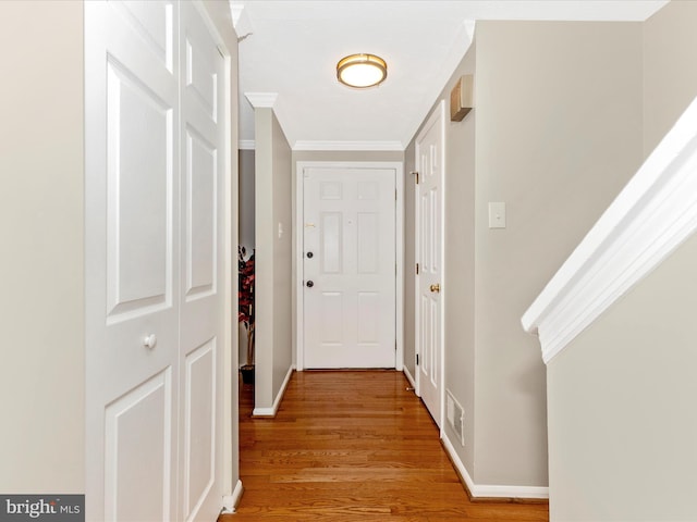 20523 Staffordshire Dr, Germantown, MD 20874 - hallway featuring light wood-style flooring, crown molding, and baseboards