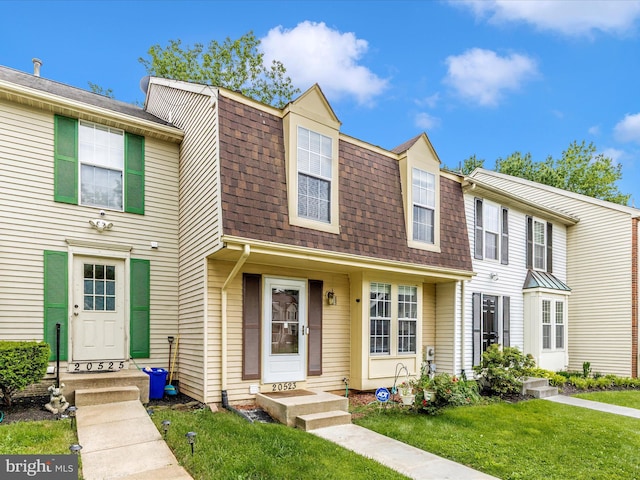 20523 Staffordshire Dr, Germantown, MD 20874 - view of property featuring roof with shingles, a front lawn, and entry steps