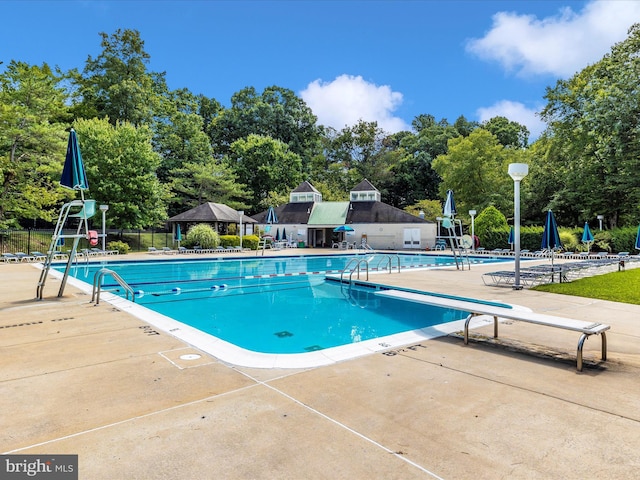 20523 Staffordshire Dr, Germantown, MD 20874 - community pool featuring a patio area, view of scattered trees, and a gazebo