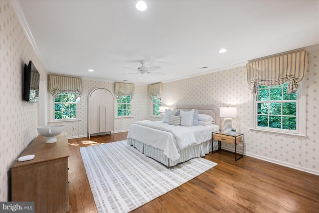 1091 Old Cedar Rd, Mclean, VA 22102 - bedroom with wallpapered walls, ornamental molding, wood finished floors, baseboards, and recessed lighting