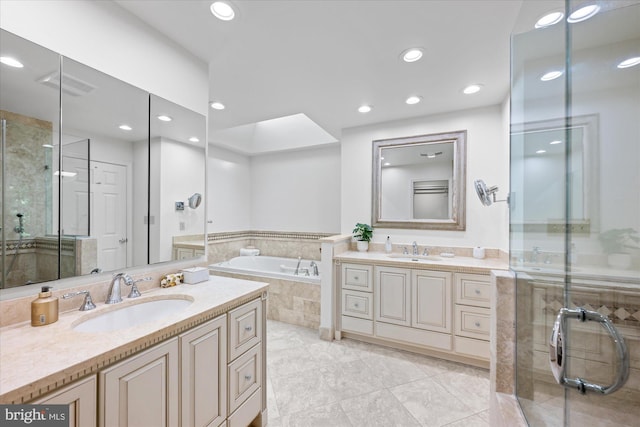 1091 Old Cedar Rd, Mclean, VA 22102 - full bath featuring two vanities, a garden tub, a stall shower, recessed lighting, and tile patterned flooring