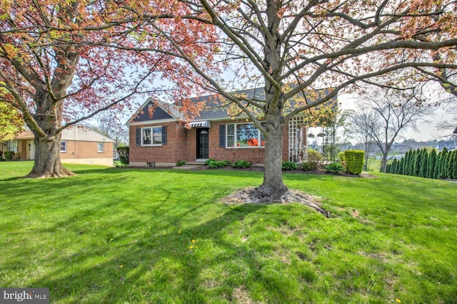 479 Church Ave, Ephrata, PA 17522 - view of front facade featuring a front yard and brick siding