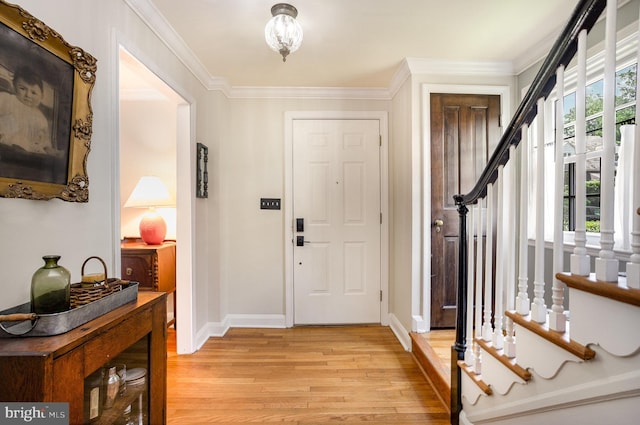 4407 Sedgwick Rd, Baltimore, MD 21210 - foyer entrance featuring light wood-type flooring, stairs, and crown molding