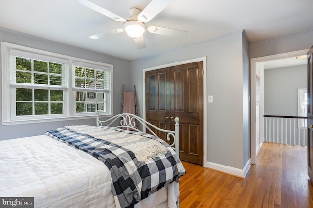 4407 Sedgwick Rd, Baltimore, MD 21210 - bedroom with light wood finished floors, a closet, a ceiling fan, and ornamental molding