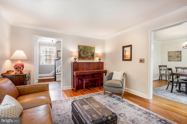 4407 Sedgwick Rd, Baltimore, MD 21210 - living room with a chandelier, ornamental molding, stairs, and wood finished floors