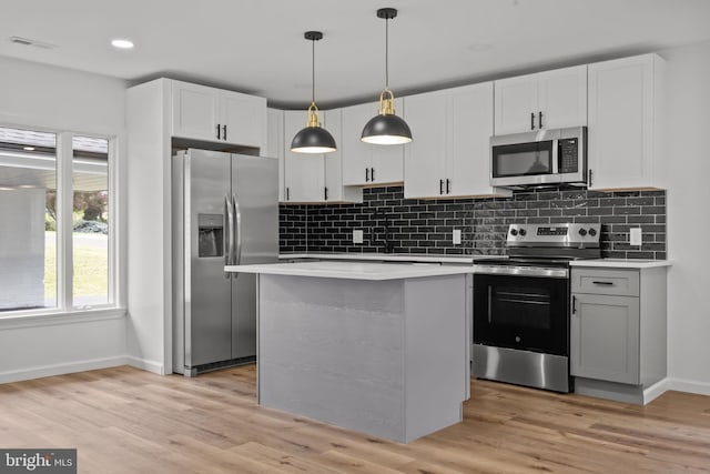 1 Mimosa Ln, Levittown, PA 19054 - kitchen with appliances with stainless steel finishes, baseboards, light countertops, tasteful backsplash, and recessed lighting