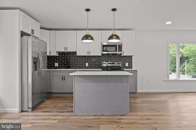 1 Mimosa Ln, Levittown, PA 19054 - kitchen with appliances with stainless steel finishes, baseboards, light countertops, light wood-type flooring, and recessed lighting