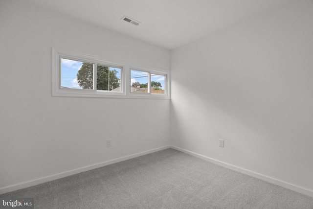 1 Mimosa Ln, Levittown, PA 19054 - carpeted empty room with plenty of natural light and baseboards