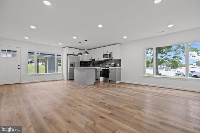 1 Mimosa Ln, Levittown, PA 19054 - kitchen featuring appliances with stainless steel finishes, open floor plan, a center island, plenty of natural light, and recessed lighting