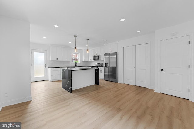 937 E Durard St, Philadelphia, PA 19150 - kitchen featuring stainless steel appliances, white cabinetry, a kitchen island, light wood finished floors, and recessed lighting
