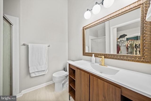 12794 Silvia Loop, Woodbridge, VA 22192 - full bathroom with vanity, a walk in closet, and a shower with shower door