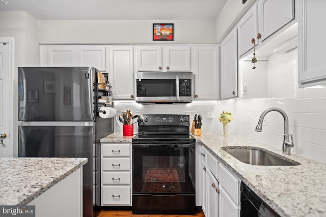 12794 Silvia Loop, Woodbridge, VA 22192 - kitchen featuring appliances with stainless steel finishes, white cabinetry, and tasteful backsplash