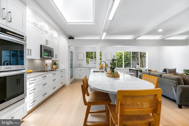 5 Tall Tree Ct, Baltimore, MD 21208 - dining room featuring light wood-style flooring, beamed ceiling, and recessed lighting