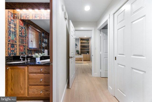 5 Tall Tree Ct, Baltimore, MD 21208 - hall featuring light wood-type flooring and a sink
