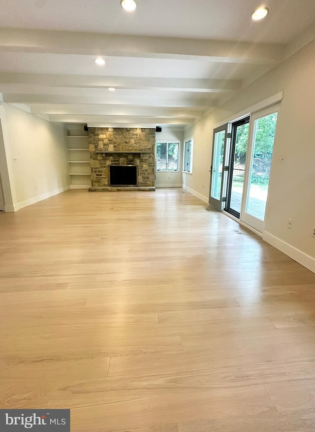 5 Tall Tree Ct, Baltimore, MD 21208 - unfurnished living room with beam ceiling, light wood-style floors, recessed lighting, and a fireplace