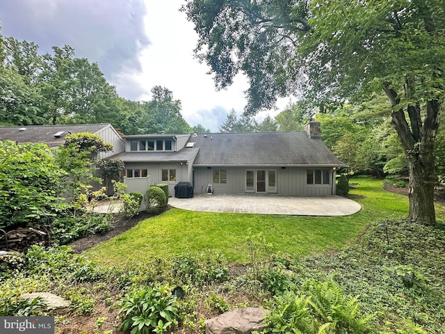 5 Tall Tree Ct, Baltimore, MD 21208 - rear view of house with a patio, a chimney, and a yard