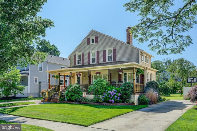 236 Ardmore Ave, Haddonfield, NJ 08033 - view of front of house with covered porch, a chimney, a front yard, and driveway