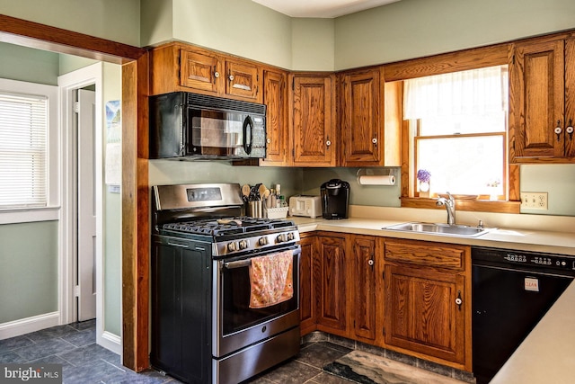 236 Ardmore Ave, Haddonfield, NJ 08033 - kitchen featuring black appliances, light countertops, and brown cabinets