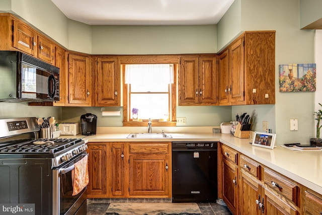 236 Ardmore Ave, Haddonfield, NJ 08033 - kitchen with black appliances, light countertops, and brown cabinetry