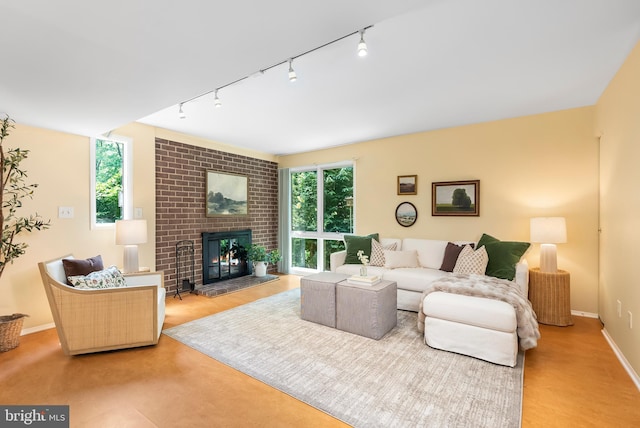 5305 Thunder Hill Rd, Columbia, MD 21045 - living area with track lighting, a brick fireplace, and baseboards