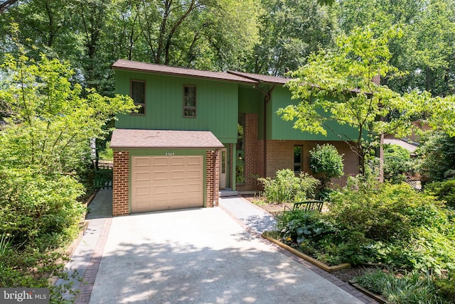 5305 Thunder Hill Rd, Columbia, MD 21045 - raised ranch with driveway, an attached garage, and brick siding