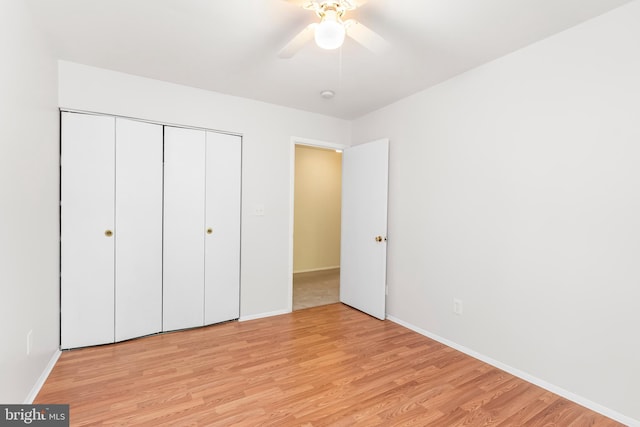 5305 Thunder Hill Rd, Columbia, MD 21045 - unfurnished bedroom featuring light wood-style floors, baseboards, a closet, and a ceiling fan