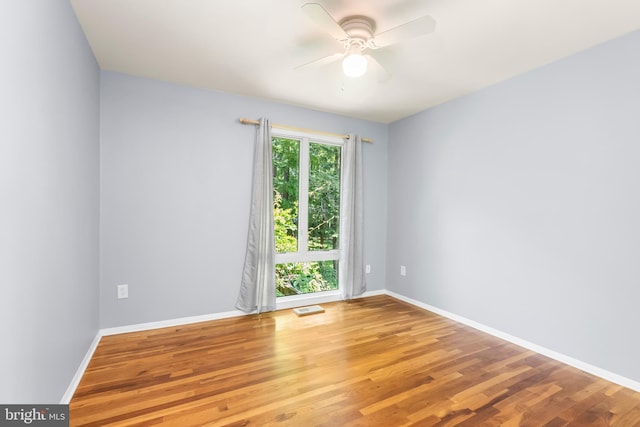 5305 Thunder Hill Rd, Columbia, MD 21045 - spare room with a ceiling fan, wood finished floors, and baseboards