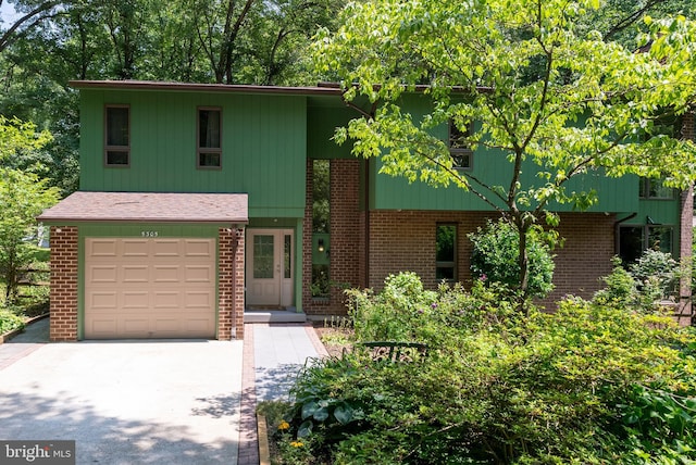 5305 Thunder Hill Rd, Columbia, MD 21045 - view of front of home featuring brick siding, concrete driveway, and an attached garage