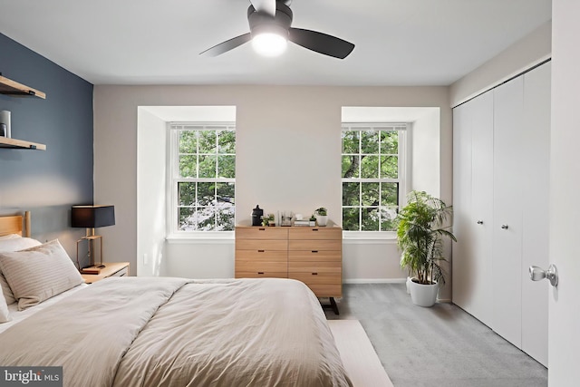 108 Bickel Ct, Sterling, VA 20165 - bedroom featuring light colored carpet, multiple windows, a closet, and baseboards