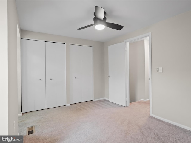 108 Bickel Ct, Sterling, VA 20165 - unfurnished bedroom with multiple closets, carpet floors, baseboards, and a ceiling fan