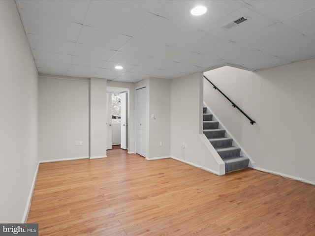 108 Bickel Ct, Sterling, VA 20165 - finished below grade area with light wood-type flooring, stairway, a drop ceiling, baseboards, and recessed lighting