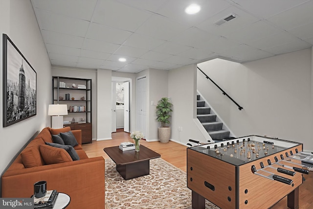 108 Bickel Ct, Sterling, VA 20165 - recreation room featuring wood finished floors, a paneled ceiling, and recessed lighting