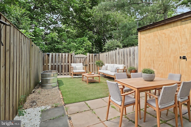 108 Bickel Ct, Sterling, VA 20165 - fenced backyard with a patio area and an outdoor living space
