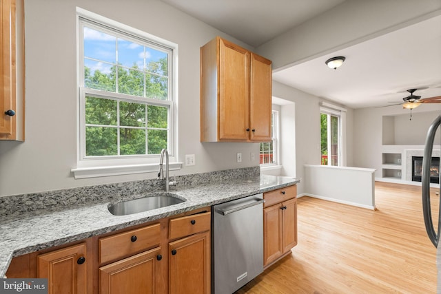 45620 Livingstone Station St, Sterling, VA 20166 - kitchen featuring dishwasher, a sink, light wood-style flooring, a ceiling fan, and light stone countertops