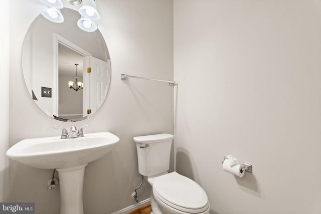 45620 Livingstone Station St, Sterling, VA 20166 - half bath with toilet and a chandelier