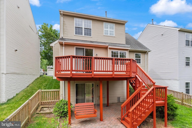 45620 Livingstone Station St, Sterling, VA 20166 - rear view of house with a wooden deck, a fenced backyard, a patio, stairs, and a shingled roof