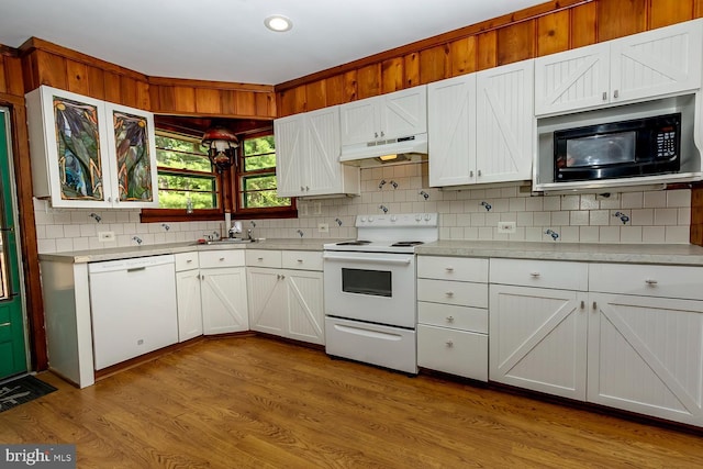 172 Chippewa Trl, Medford Lakes, NJ 08055 - kitchen featuring white appliances, under cabinet range hood, tasteful backsplash, light countertops, and white cabinetry