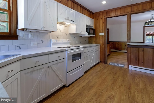 172 Chippewa Trl, Medford Lakes, NJ 08055 - kitchen featuring white electric stove, black microwave, a baseboard heating unit, light countertops, and under cabinet range hood