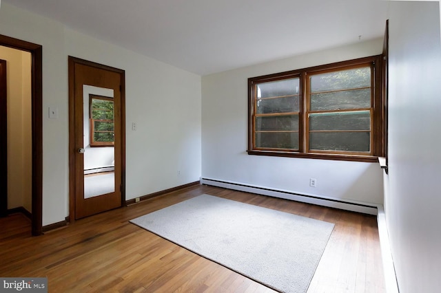 172 Chippewa Trl, Medford Lakes, NJ 08055 - spare room featuring a baseboard radiator, wood finished floors, a baseboard heating unit, and baseboards