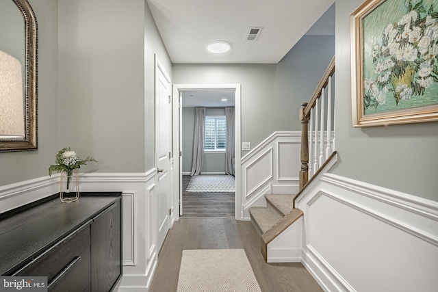 1009 Lakeview Ct Unit 1009, King Of Prussia, PA 19406 - entryway with a decorative wall, dark wood finished floors, a wainscoted wall, and stairway