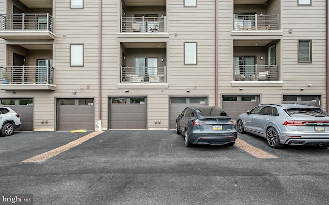1009 Lakeview Ct Unit 1009, King Of Prussia, PA 19406 - view of building exterior featuring a garage and driveway