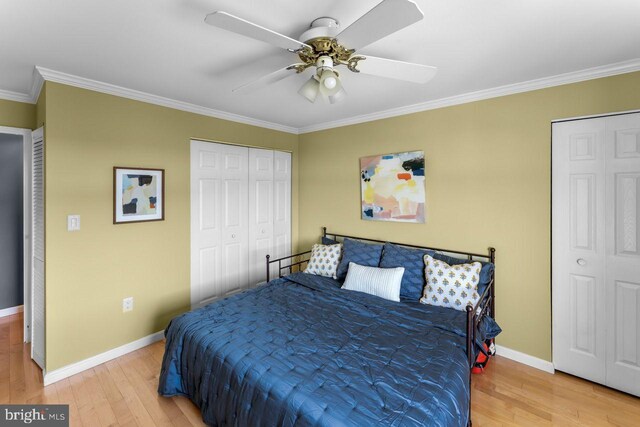 bedroom featuring crown molding, light wood-style flooring, baseboards, and ceiling fan