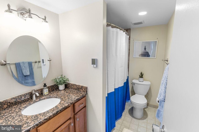 bathroom featuring vanity, toilet, and a shower with curtain