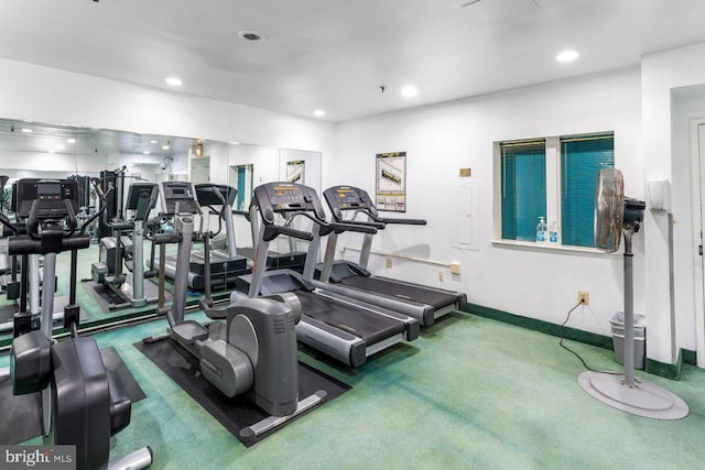 gym featuring recessed lighting, baseboards, and carpet flooring