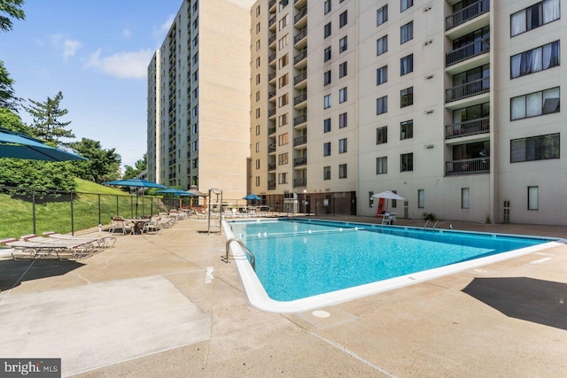 community pool featuring a patio area