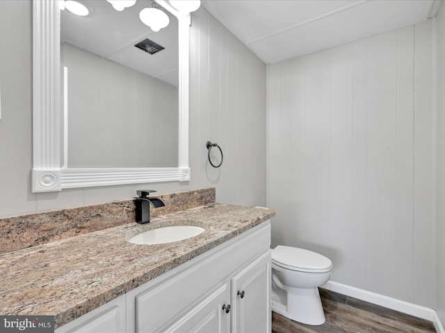 20 E Market St, Schuylkill Haven, PA 17972 - bathroom with vanity, wood finished floors, and toilet