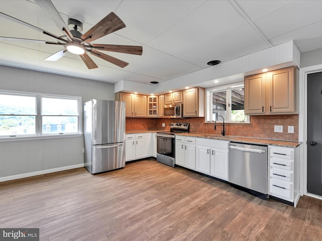 20 E Market St, Schuylkill Haven, PA 17972 - kitchen with stainless steel appliances, a ceiling fan, healthy amount of natural light, and decorative backsplash
